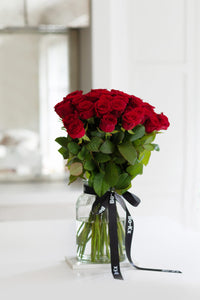 red rose bouquet in a jar vase