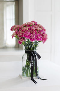 pink carnation bouquet in a glass jar
