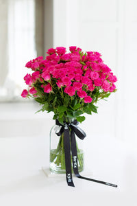 pink rose bouquet in a glass jar