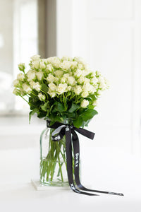 white rose bouquet in a jar